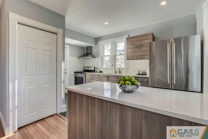 37 Wiggins Street, Unit 2 Princeton, NJ 08540 - Photo 16 of 25 a kitchen with stainless steel appliances a sink and a refrigerator