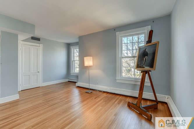 37 Wiggins Street, Unit 2 Princeton, NJ 08540 - Photo 19 of 25 a view of room with window and wooden floor