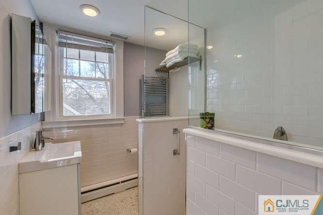37 Wiggins Street, Unit 2 Princeton, NJ 08540 - Photo 25 of 25 a bathroom with a sink a toilet and a mirror