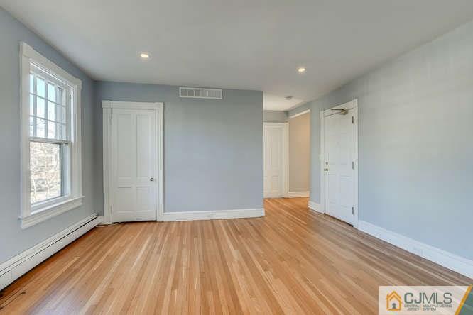 37 Wiggins Street, Unit 2 Princeton, NJ 08540 - Photo 7 of 25 a view of an empty room with wooden floor and window