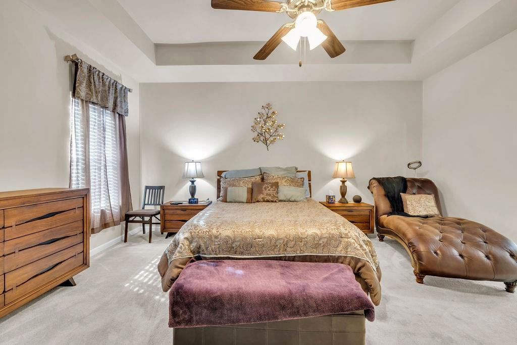 549 Harmony Way Locust Grove, GA 30248 - Photo 11 of 28 a bedroom with a bed and wooden floor