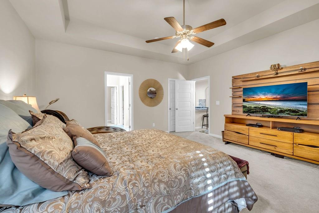 549 Harmony Way Locust Grove, GA 30248 - Photo 12 of 28 a bedroom with a bed and a flat screen tv