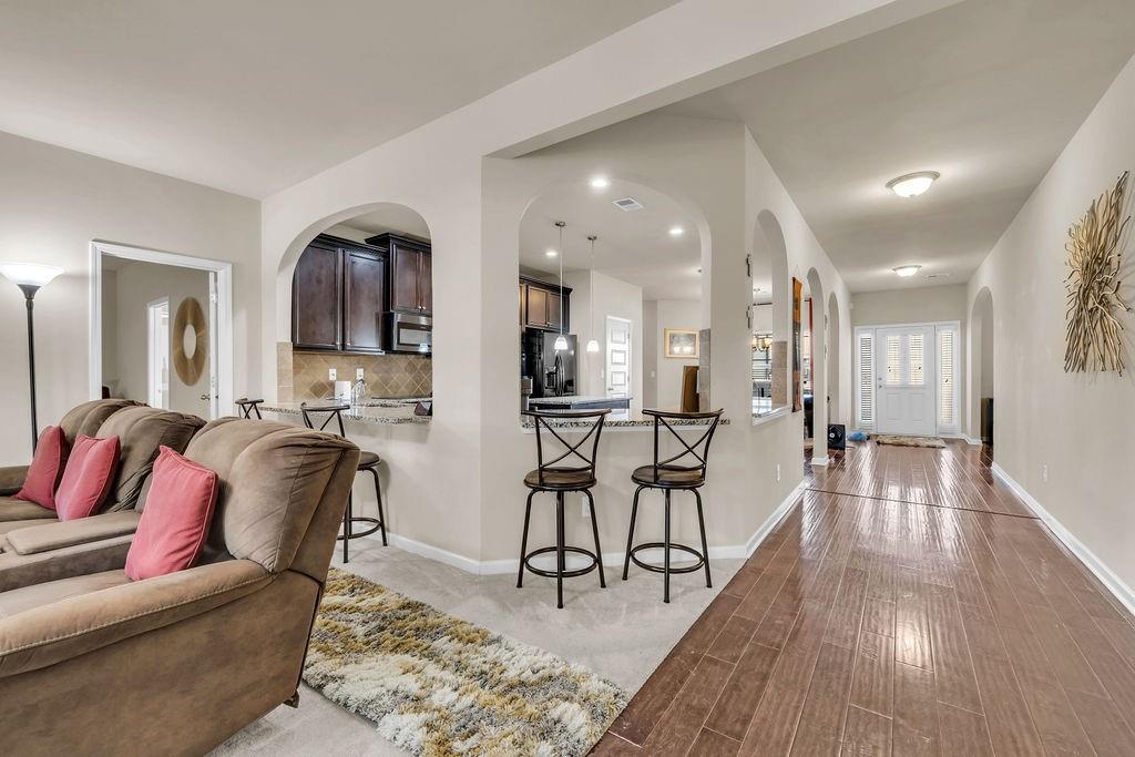 549 Harmony Way Locust Grove, GA 30248 - Photo 23 of 28 a living room with furniture and wooden floor
