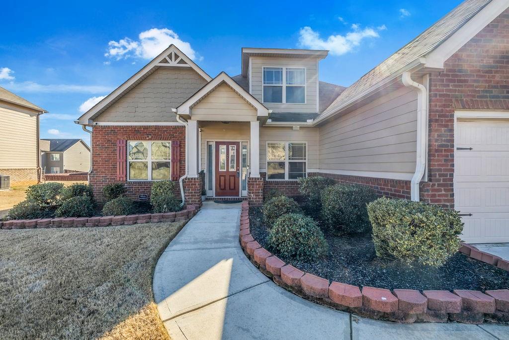 549 Harmony Way Locust Grove, GA 30248 - Photo 24 of 28 a front view of a house with a yard
