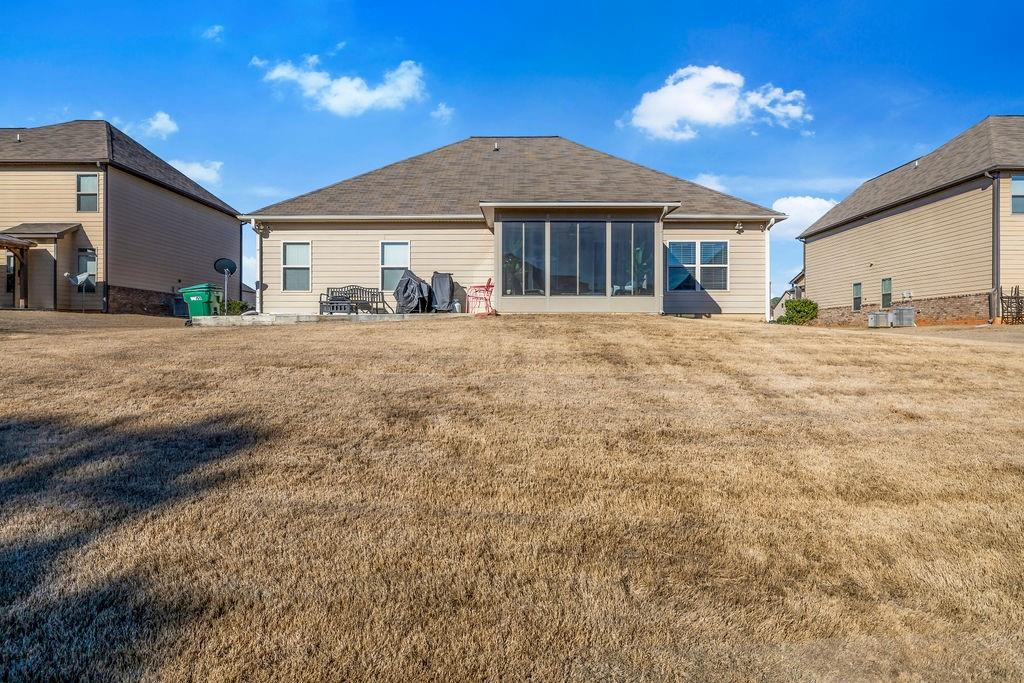 549 Harmony Way Locust Grove, GA 30248 - Photo 27 of 28 a front view of a house with a yard