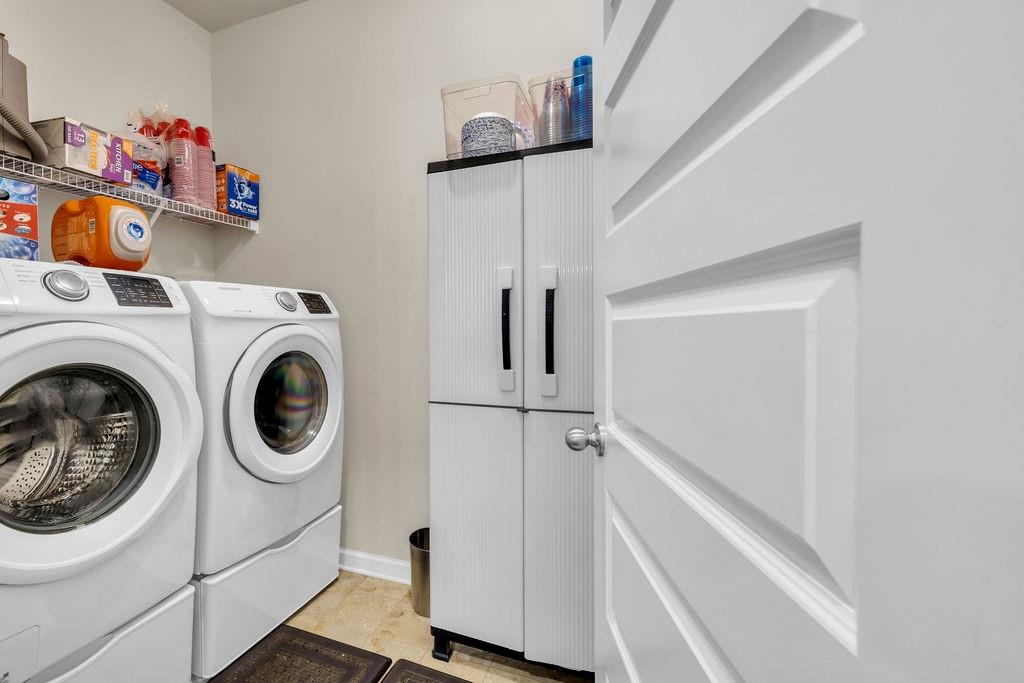 549 Harmony Way Locust Grove, GA 30248 - Photo 4 of 28 a utility room with dryer and washer