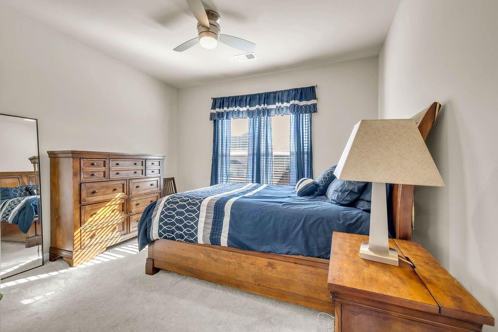 549 Harmony Way Locust Grove, GA 30248 - Photo 7 of 28 a bedroom with a bed couch and window