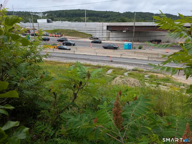 a view of a park with swings and slides