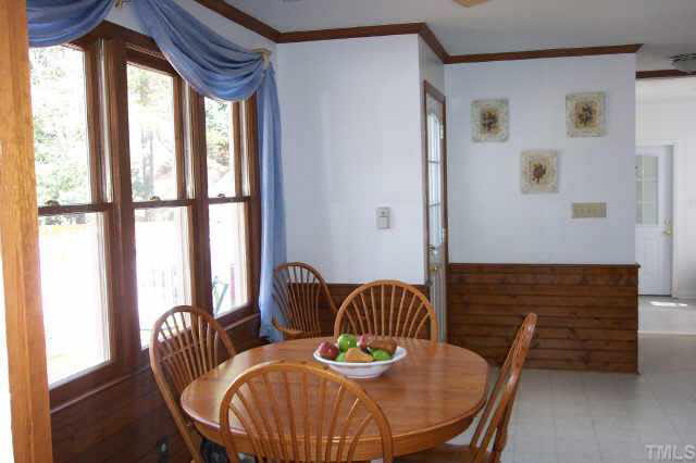 1201 Ravens Point Circle Raleigh, NC 27614 - Photo 5 of 8 a view of a dining room with furniture window and outside view