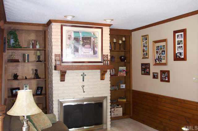 1201 Ravens Point Circle Raleigh, NC 27614 - Photo 7 of 8 a living room with furniture and a lamp