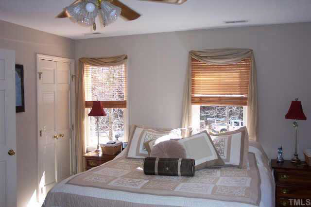 1201 Ravens Point Circle Raleigh, NC 27614 - Photo 8 of 8 a bedroom with a large bed and a window