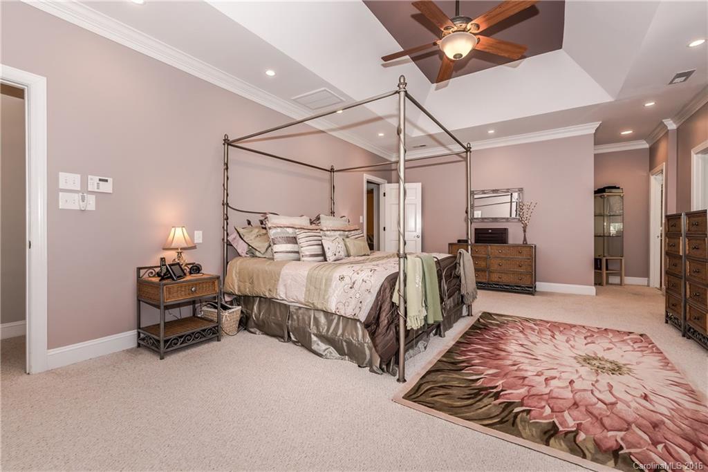 1644 Windy Ridge Road Charlotte, NC 28270 - Photo 14 of 24 a bedroom with bed and wooden floor