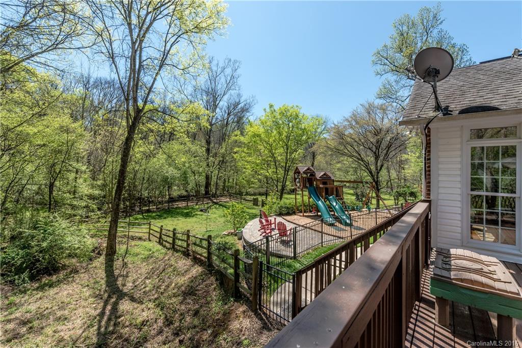 1644 Windy Ridge Road Charlotte, NC 28270 - Photo 22 of 24 a view of a patio and deck in the backyard