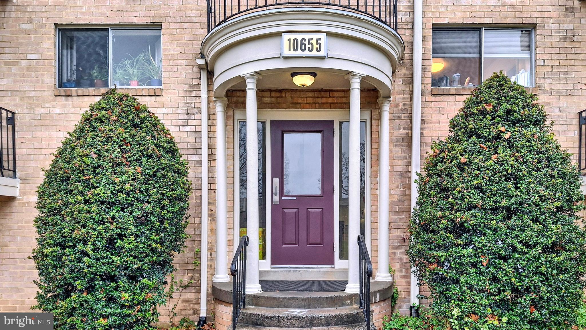 10655 Montrose Avenue, Unit 103 Bethesda, MD 20814 - Photo 23 of 26 a front view of a house with a garden