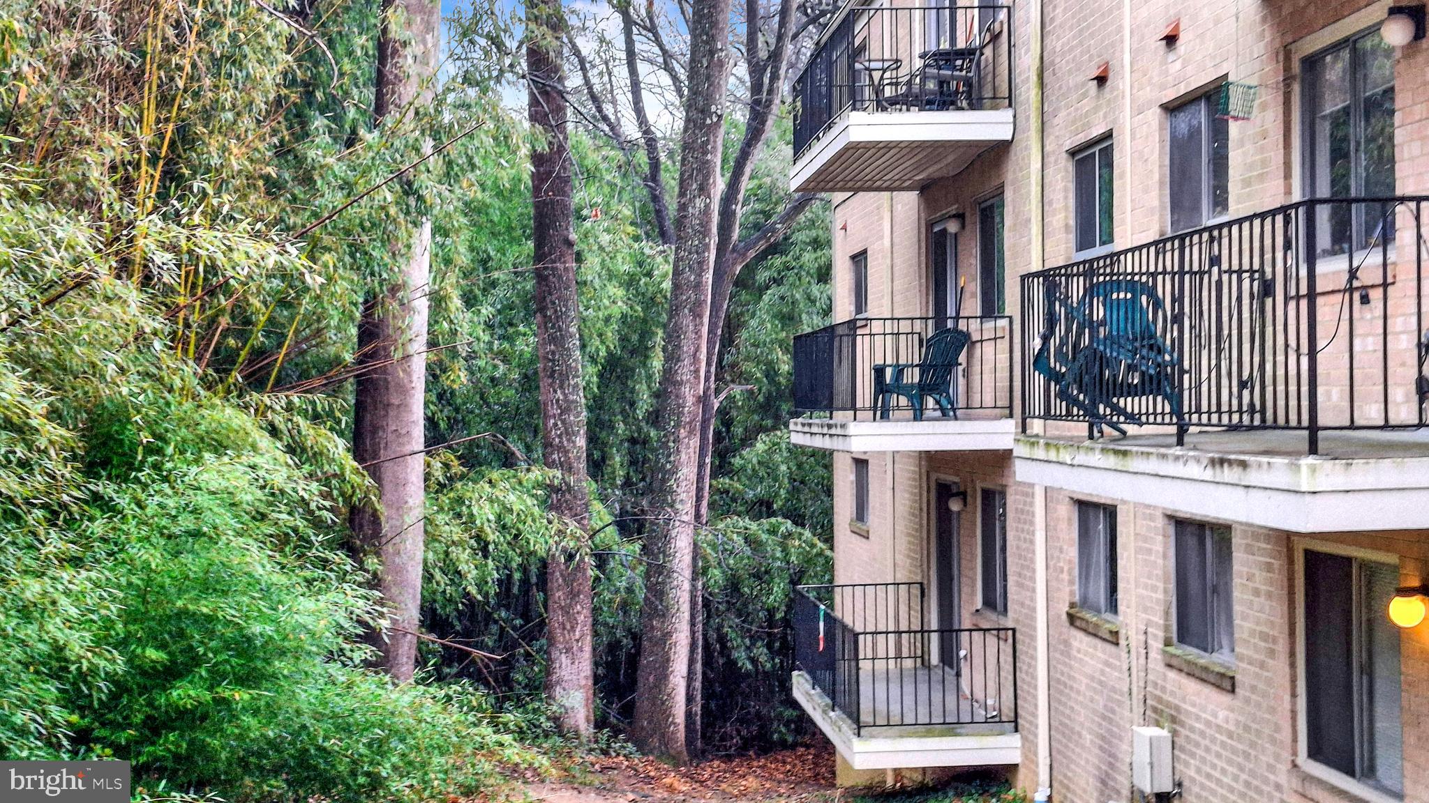 10655 Montrose Avenue, Unit 103 Bethesda, MD 20814 - Photo 24 of 26 a view of a house with fountain and deck