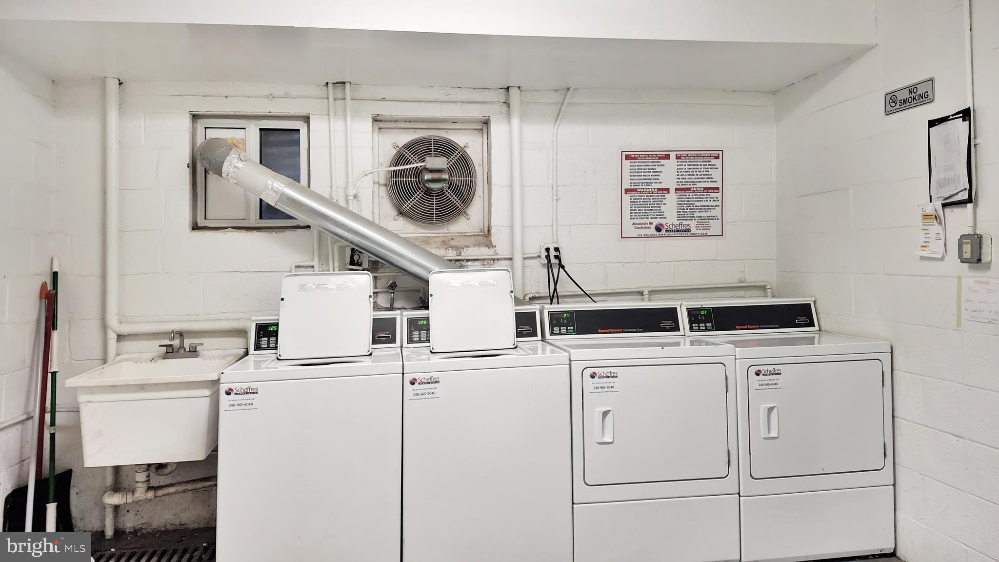 10655 Montrose Avenue, Unit 103 Bethesda, MD 20814 - Photo 25 of 26 a kitchen with a stove and a refrigerator