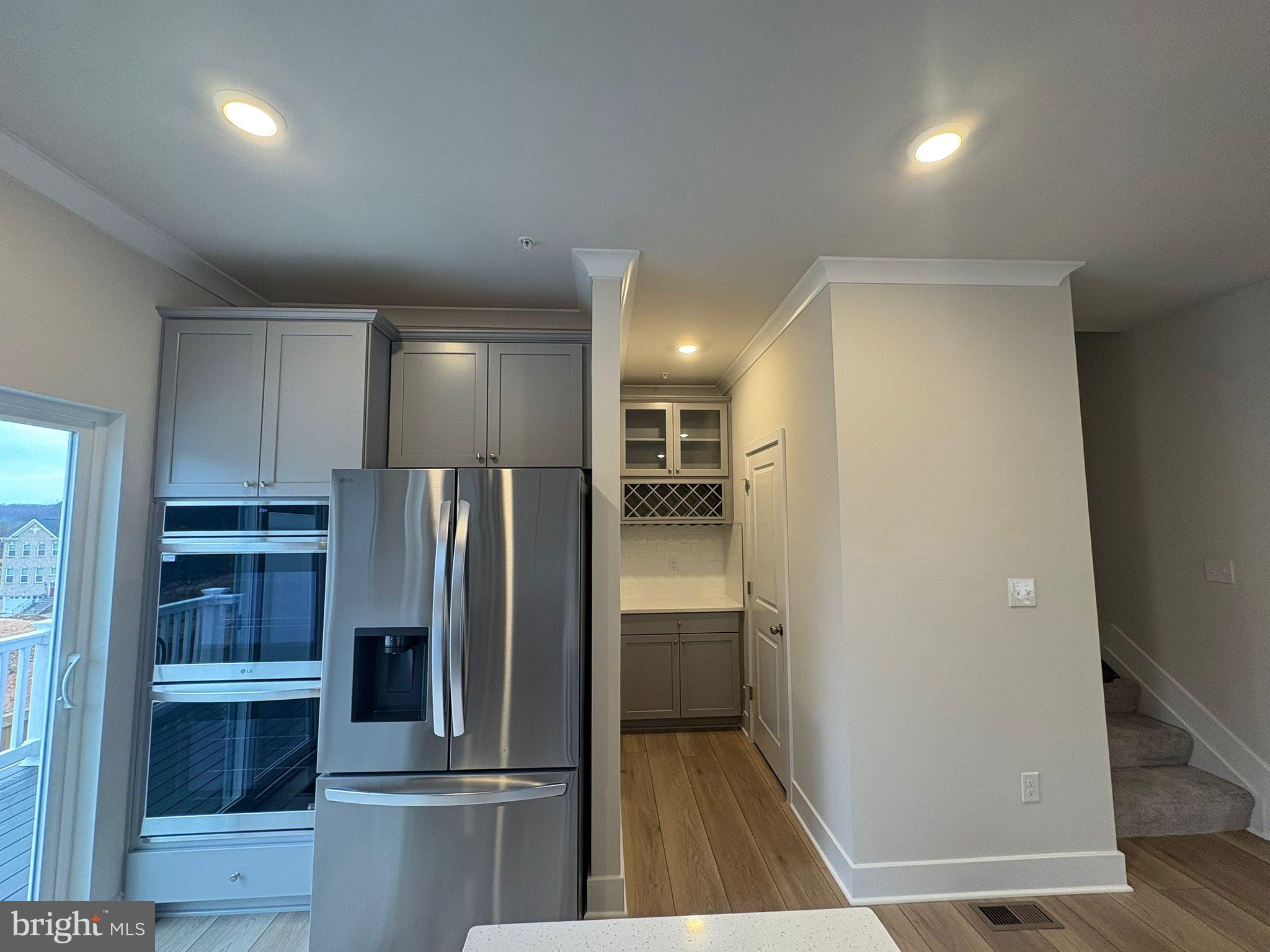 1734 Water Xing Road Baltimore, MD 21208 - Photo 4 of 14 a view of a refrigerator in kitchen and a sink