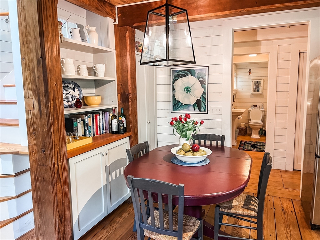 225 Lamberts Cove Road West Tisbury, MA 02568 - Photo 6 of 33 a dining room with furniture and wooden floor