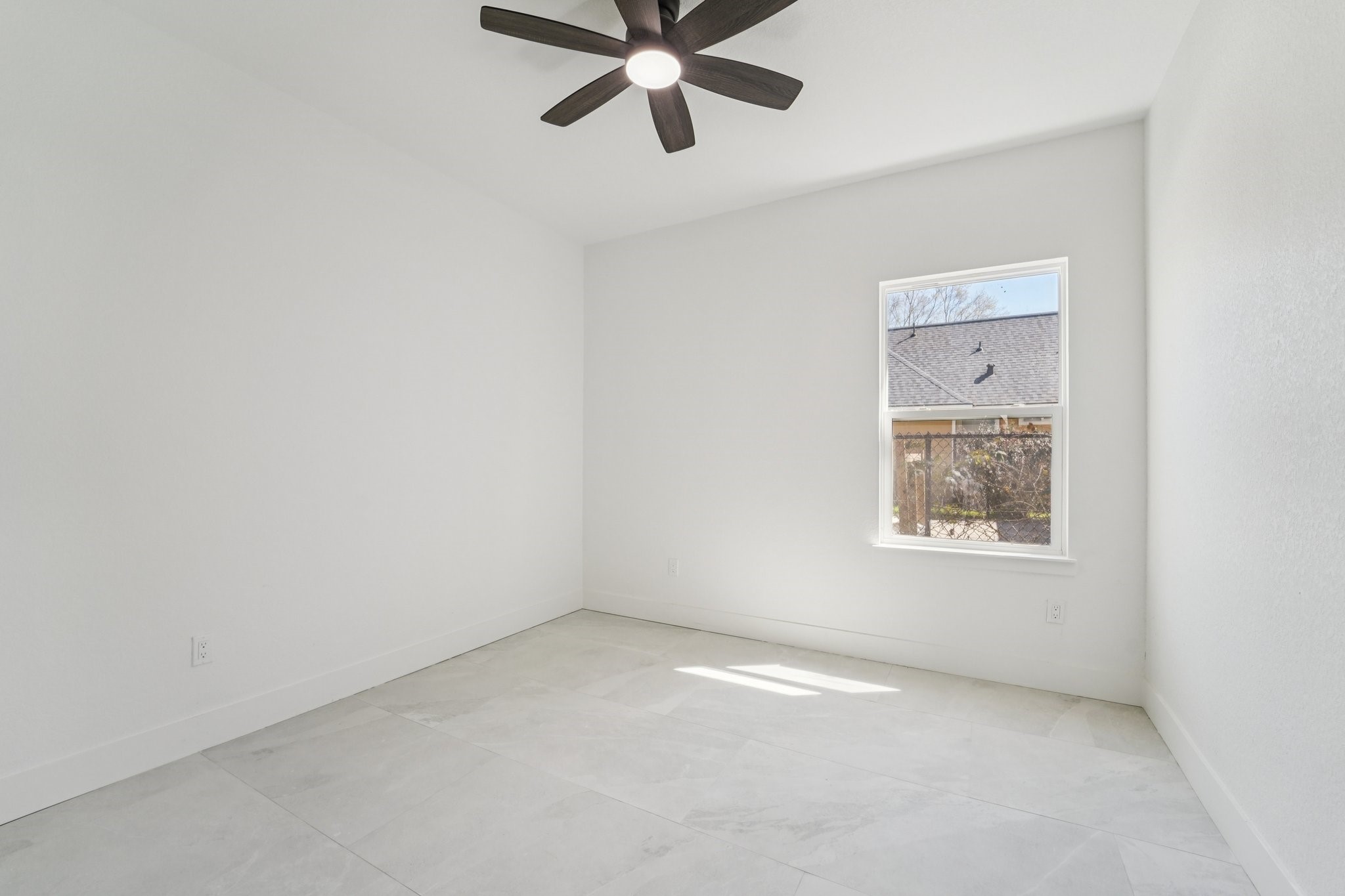 708 South Carroll Street La Porte, TX 77571 - Photo 24 of 29 an empty room with a window and a ceiling fan