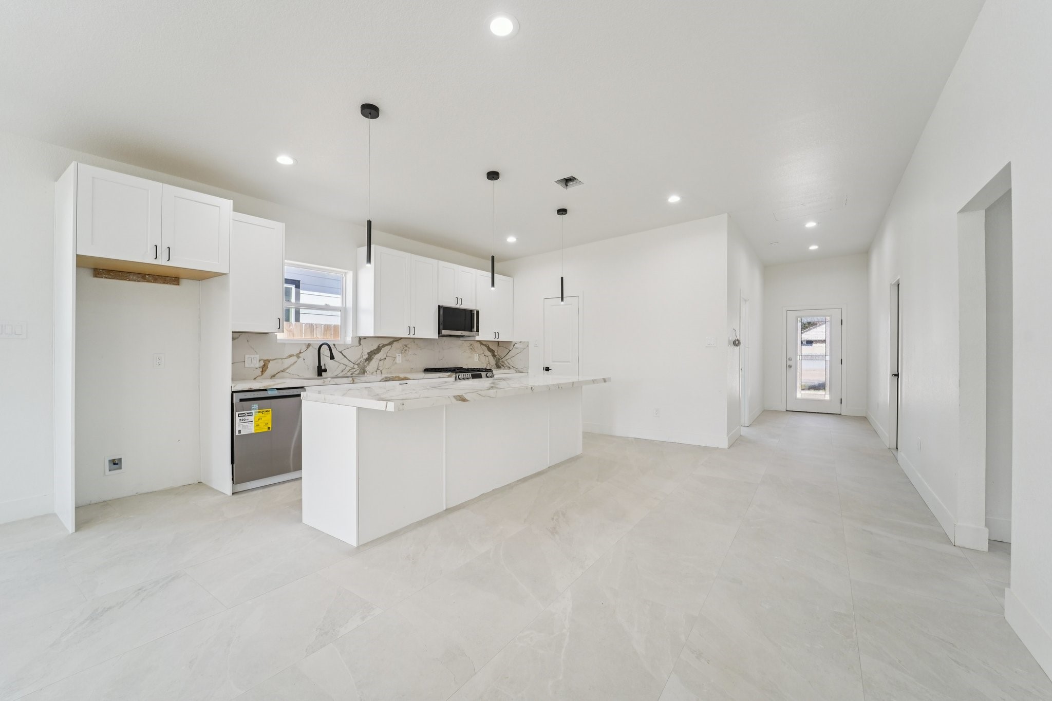 708 South Carroll Street La Porte, TX 77571 - Photo 7 of 29 a view of kitchen with kitchen island white cabinets and stainless steel appliances