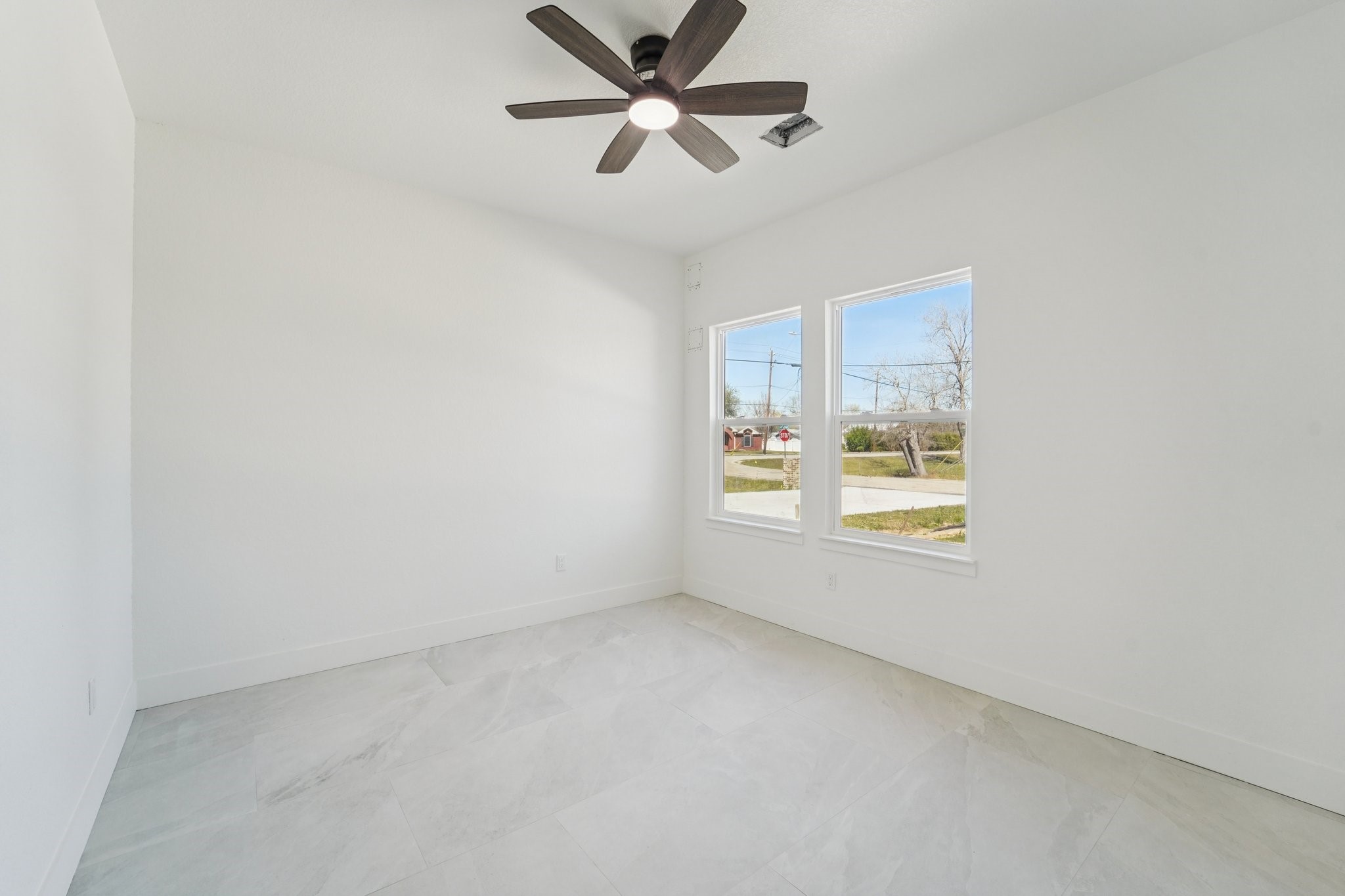 708 South Carroll Street La Porte, TX 77571 - Photo 10 of 29 an empty room with a window and a fan