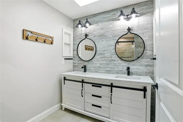 a bathroom with a sink and a mirror
