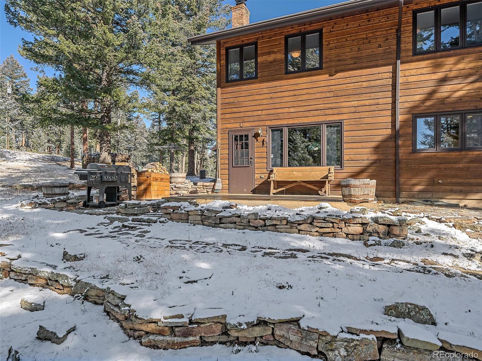 7990 Tim Tam Trail Evergreen, CO 80439 - Photo 33 of 45 a view of a backyard of the house