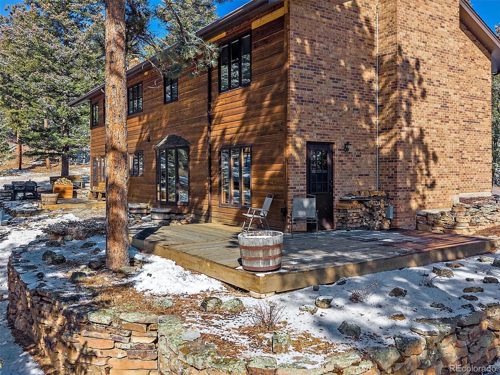 7990 Tim Tam Trail Evergreen, CO 80439 - Photo 36 of 45 a view of a building with traffic signal