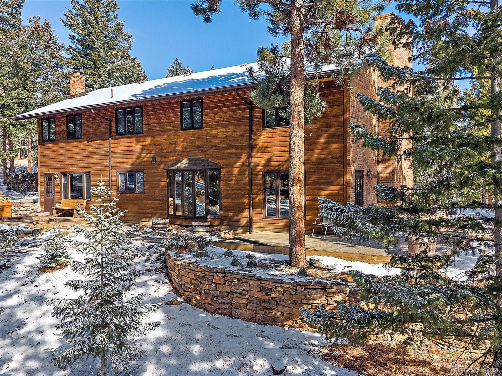 7990 Tim Tam Trail Evergreen, CO 80439 - Photo 4 of 45 a view of a house with backyard