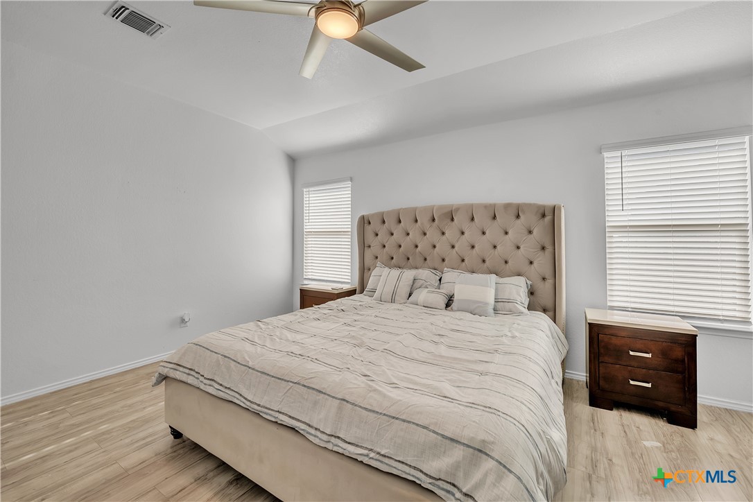 5577 Perdita Drive Belton, TX 76513 - Photo 12 of 25 a bedroom with a bed and a ceiling fan
