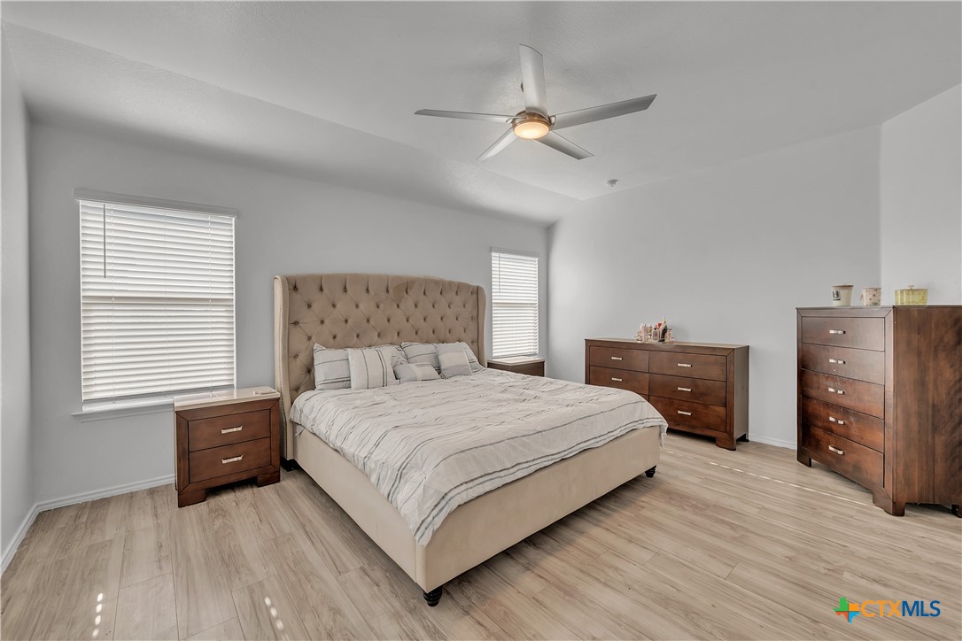 5577 Perdita Drive Belton, TX 76513 - Photo 13 of 25 a bedroom with a bed and a dresser