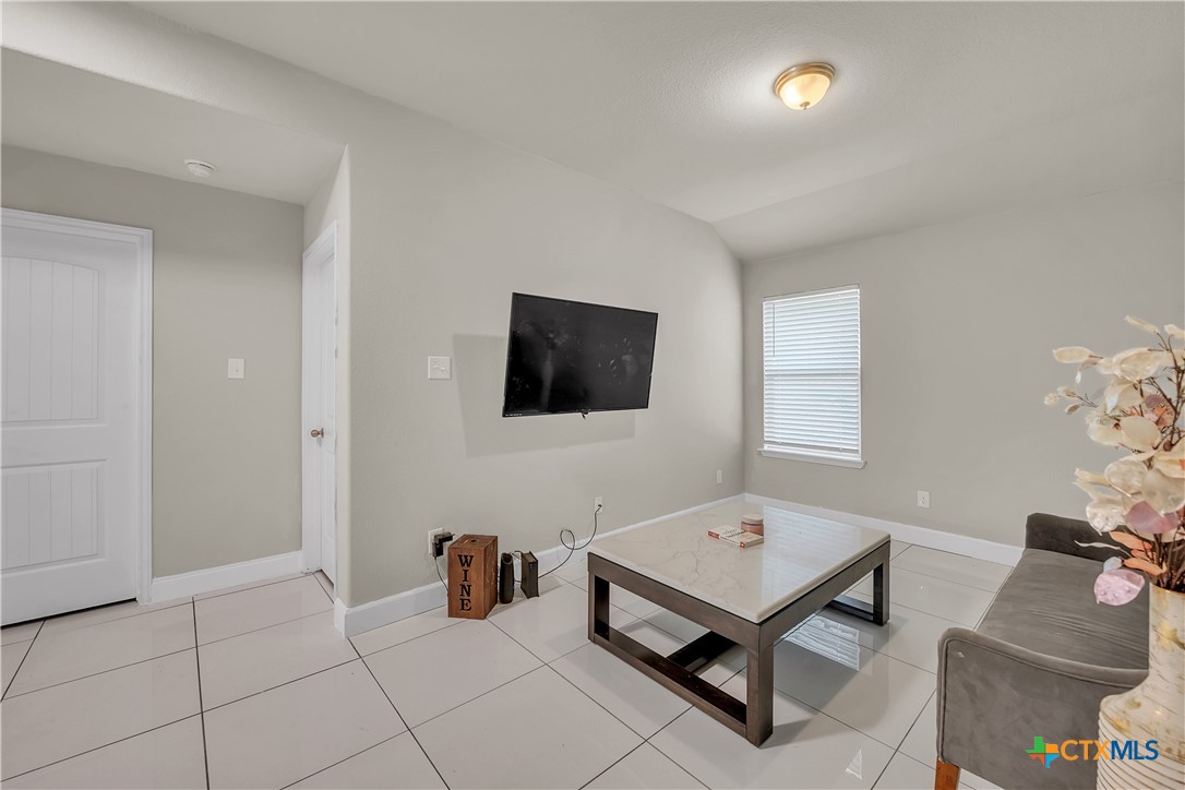 5577 Perdita Drive Belton, TX 76513 - Photo 18 of 25 a living room with furniture and a flat screen tv