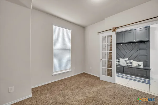an empty room with windows