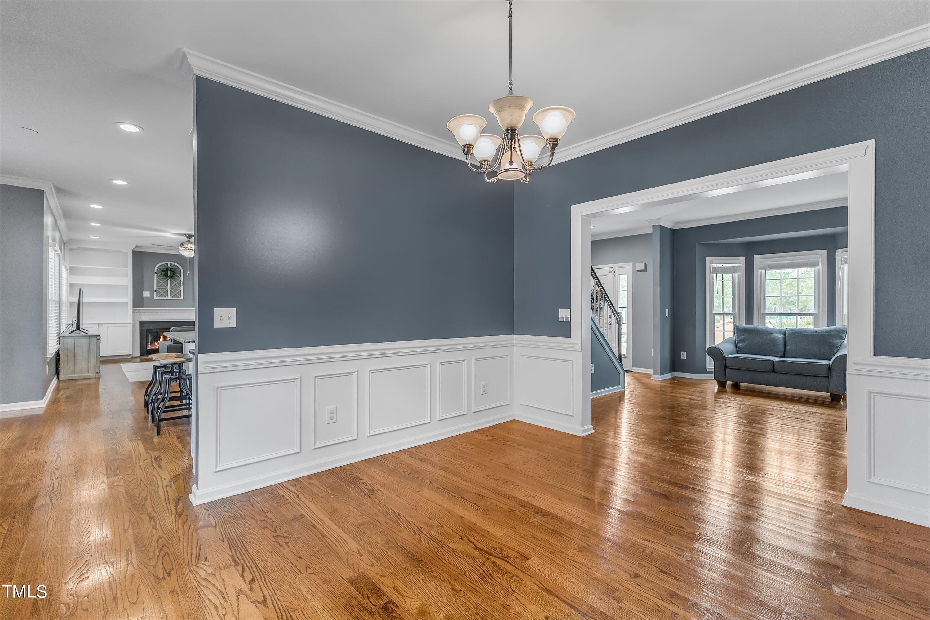 2424 Havershire Drive Raleigh, NC 27613 - Photo 16 of 52 a view of a livingroom with a furniture wooden floor and kitchen