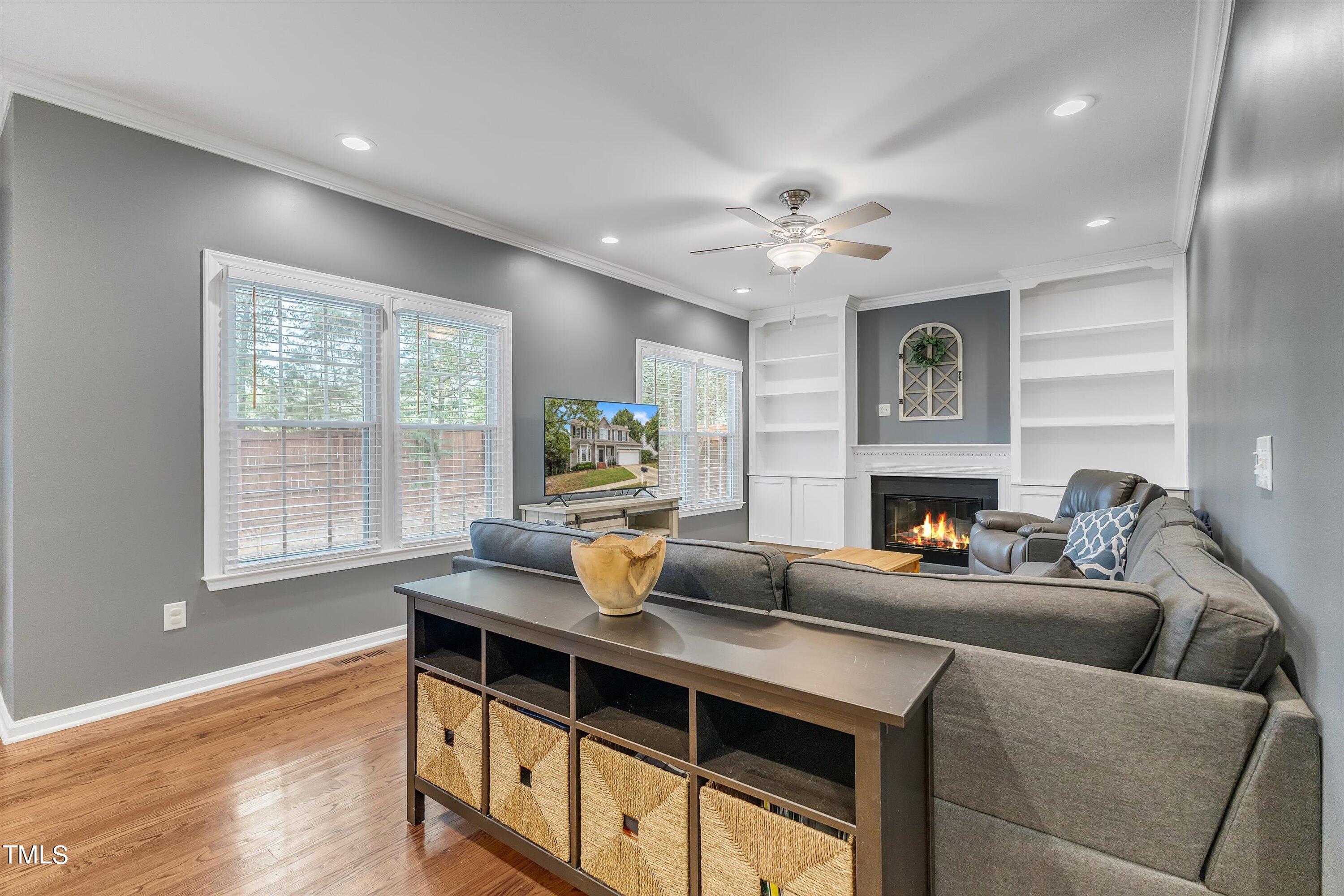 2424 Havershire Drive Raleigh, NC 27613 - Photo 17 of 52 a living room with furniture and a fireplace