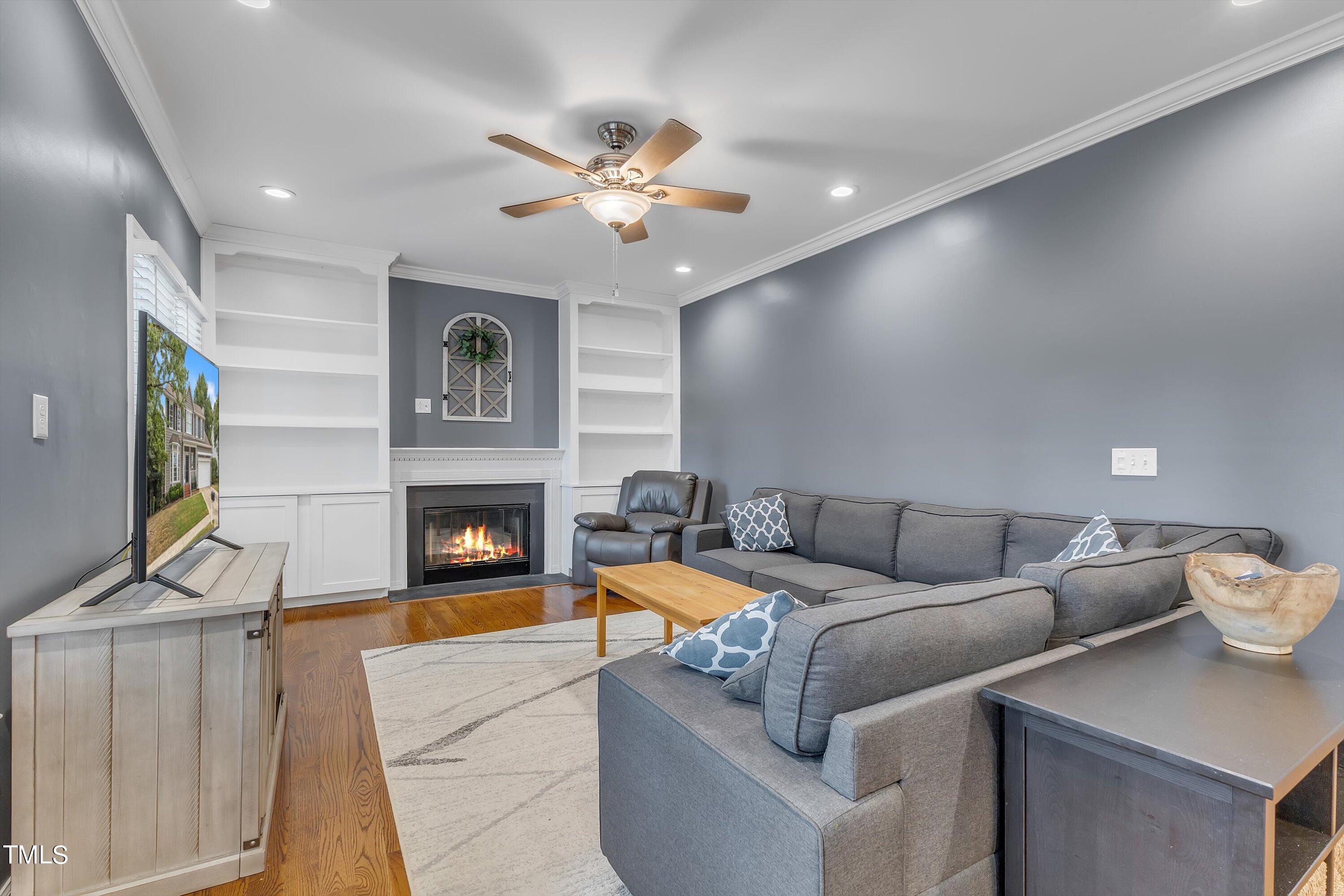 2424 Havershire Drive Raleigh, NC 27613 - Photo 19 of 52 a living room with furniture and a fireplace