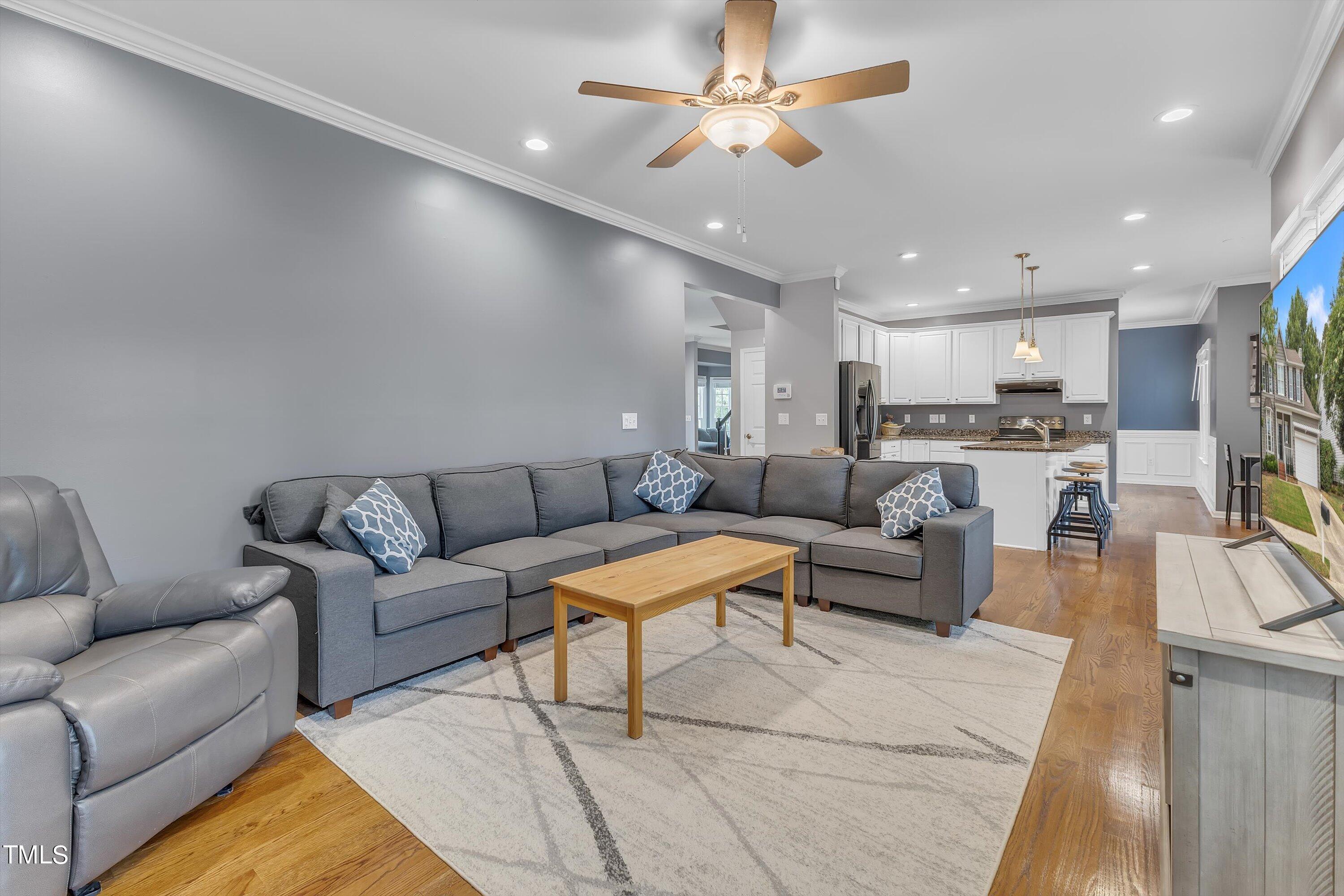 2424 Havershire Drive Raleigh, NC 27613 - Photo 20 of 52 a living room with furniture and kitchen view