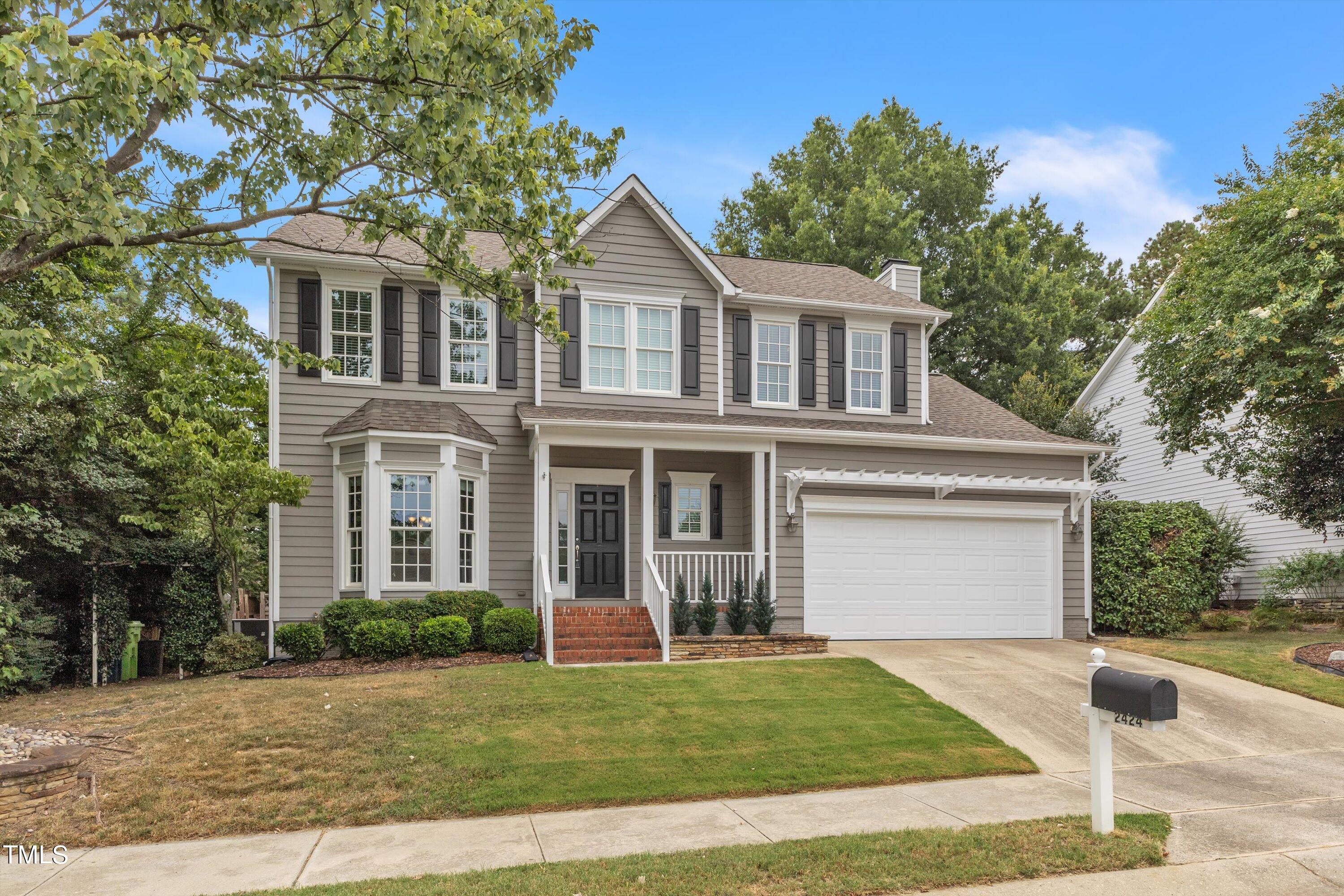 2424 Havershire Drive Raleigh, NC 27613 - Photo 2 of 52 a front view of a house with a yard