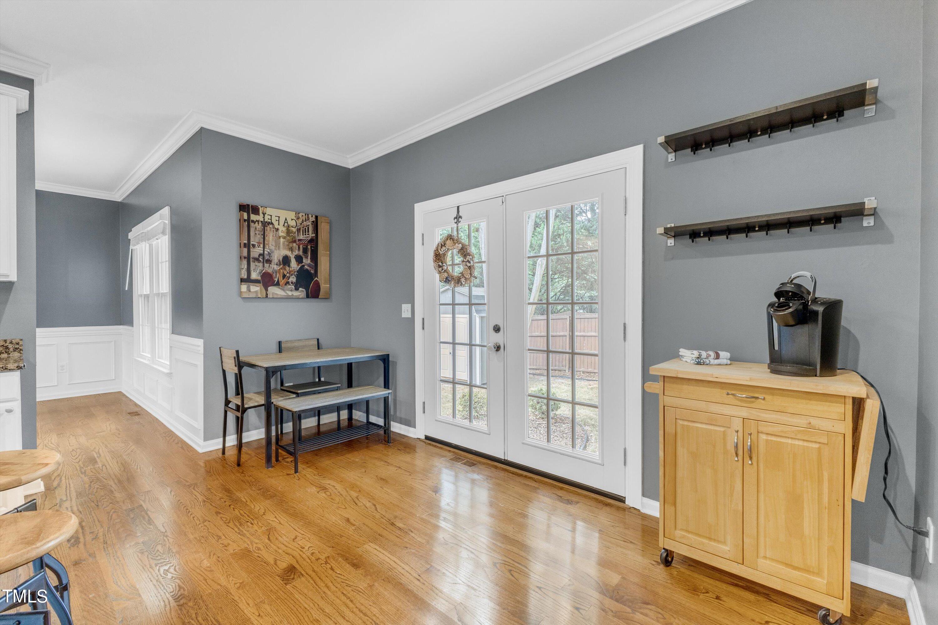 2424 Havershire Drive Raleigh, NC 27613 - Photo 22 of 52 a view of kitchen with furniture and wooden floor