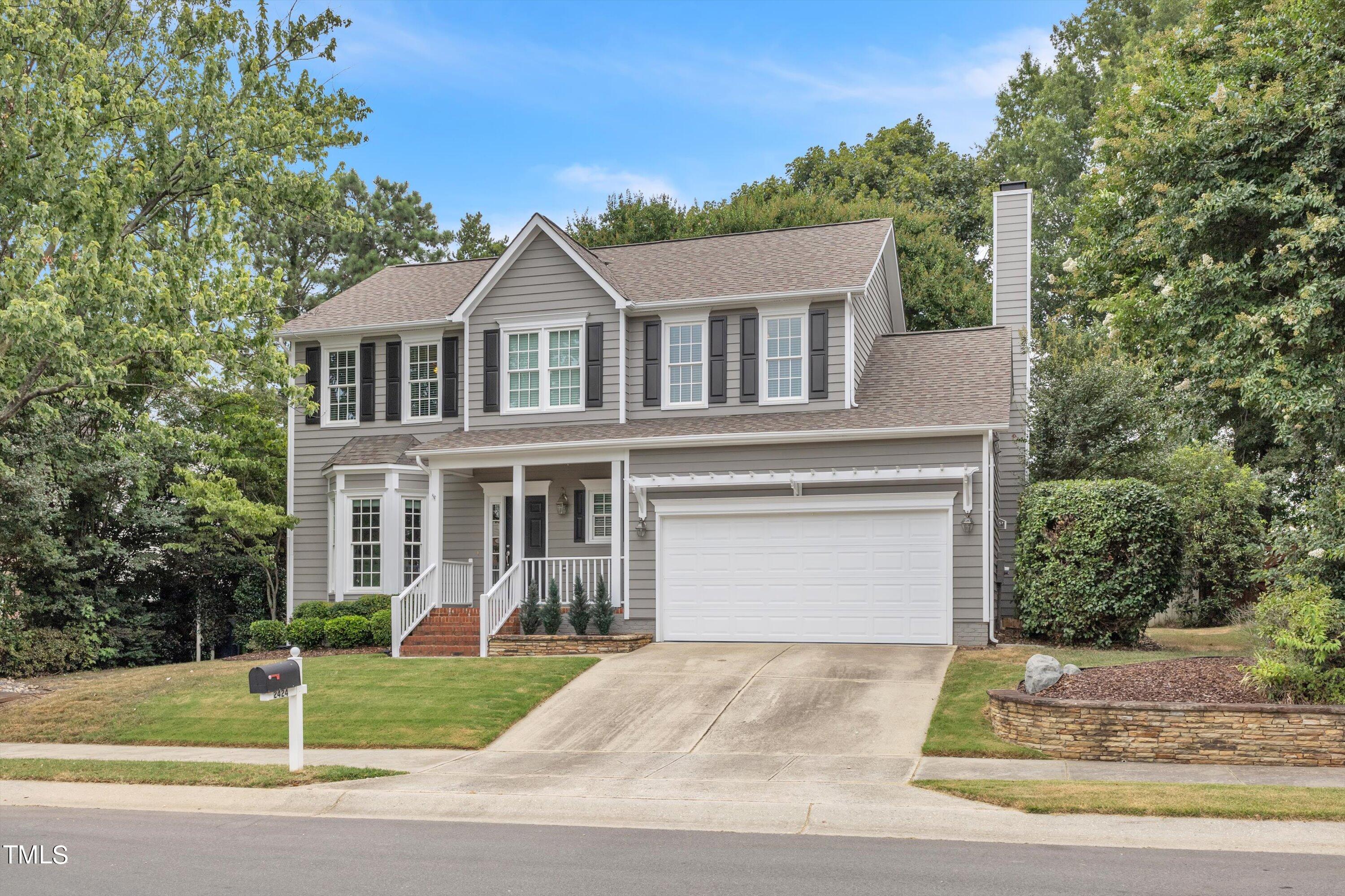 2424 Havershire Drive Raleigh, NC 27613 - Photo 3 of 52 a front view of a house with a yard and garage