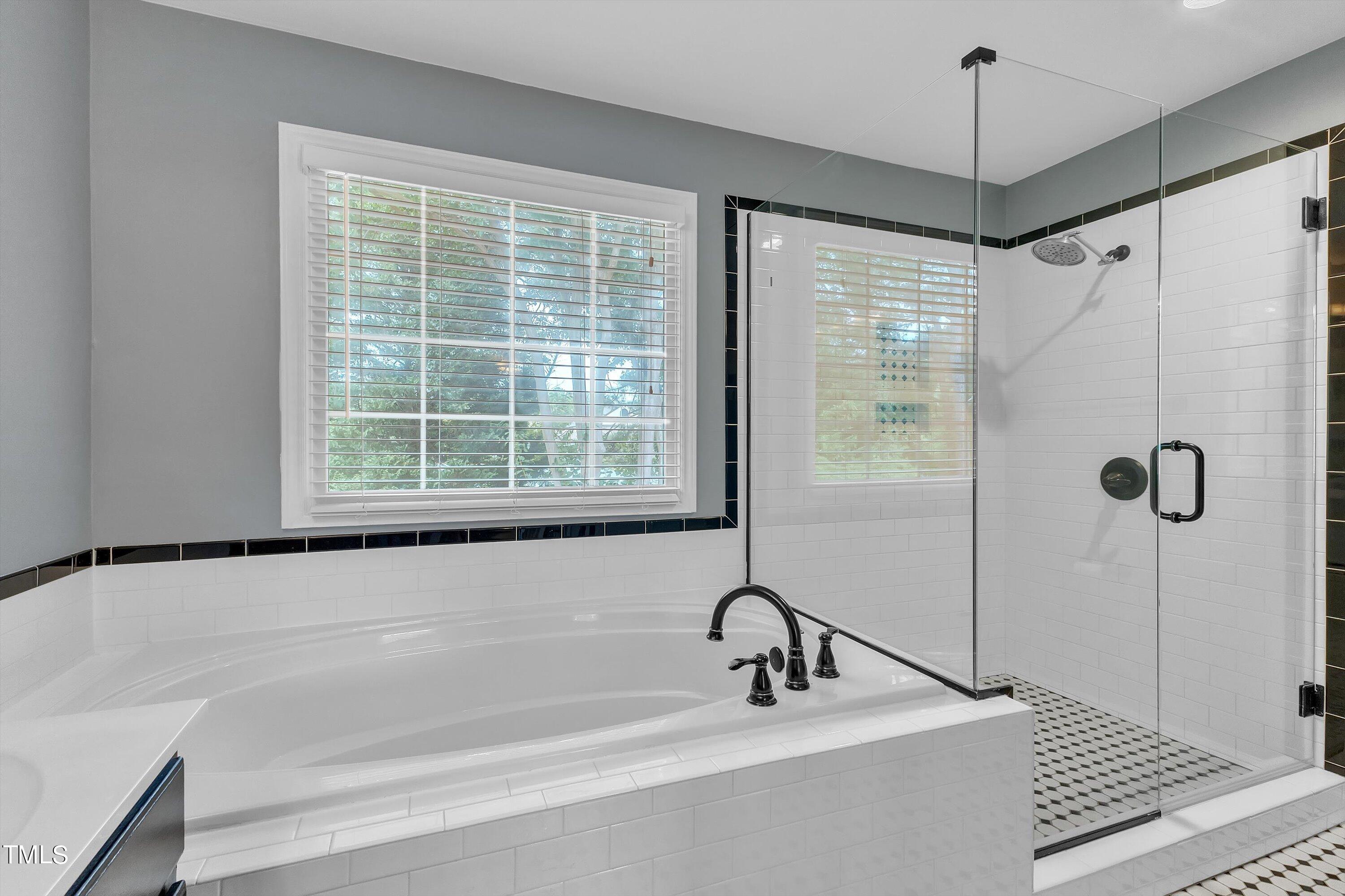 2424 Havershire Drive Raleigh, NC 27613 - Photo 38 of 52 a bathroom with a shower and a sink