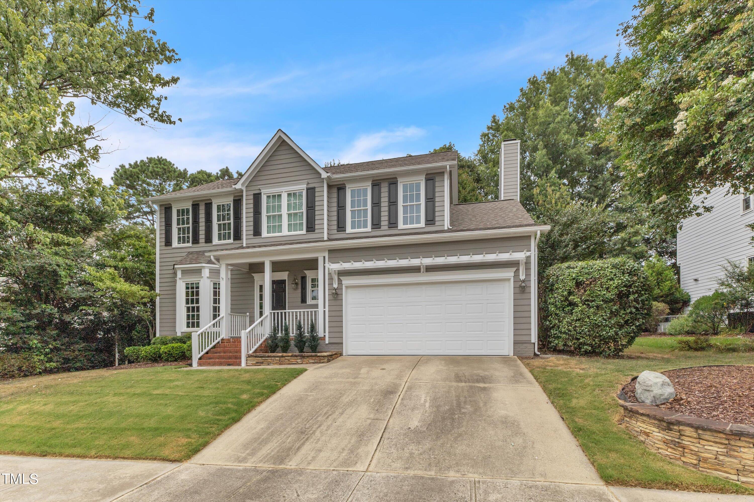 2424 Havershire Drive Raleigh, NC 27613 - Photo 4 of 52 a front view of a house with a yard and garage