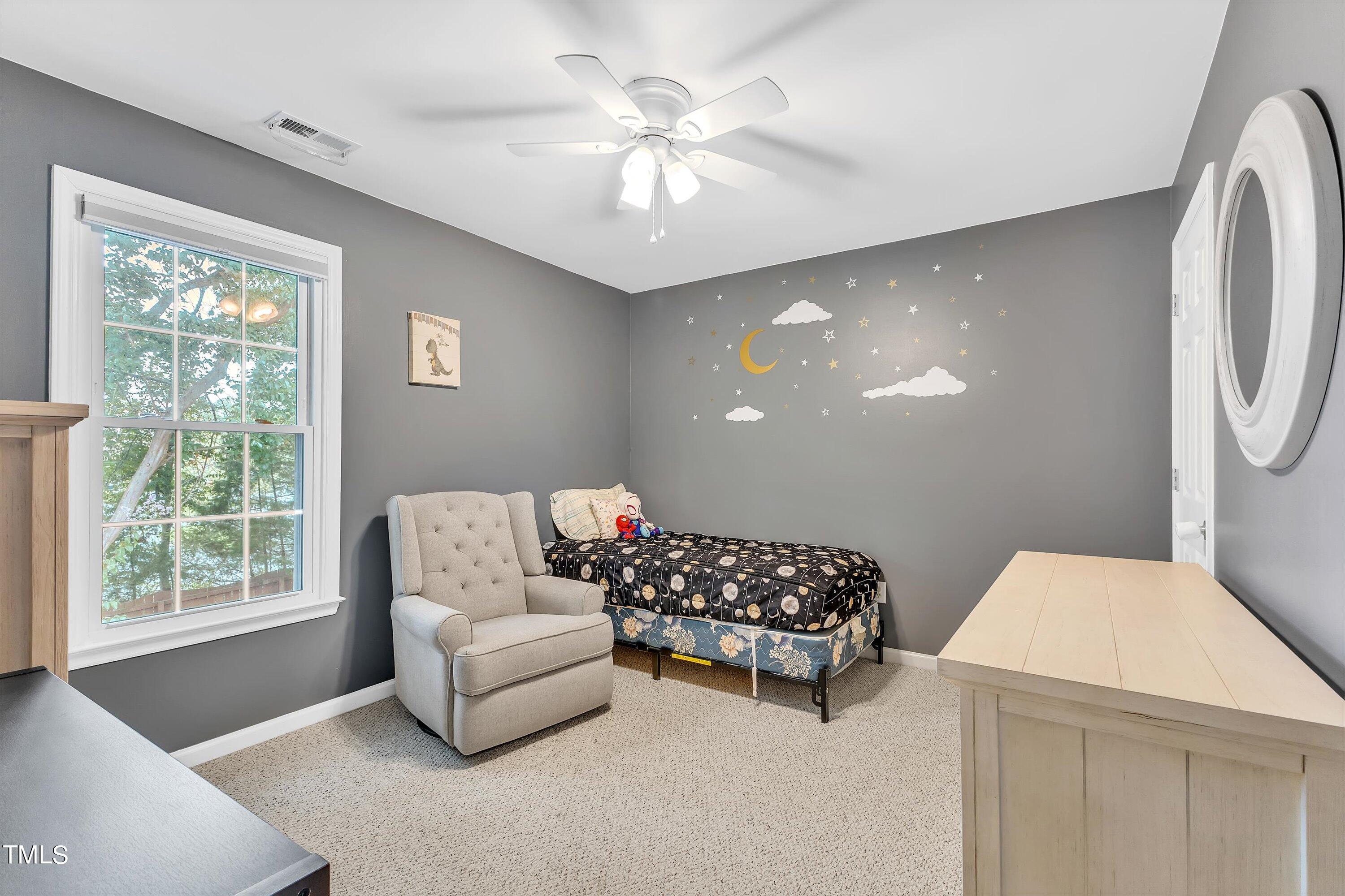 2424 Havershire Drive Raleigh, NC 27613 - Photo 42 of 52 a living room with furniture and a large window