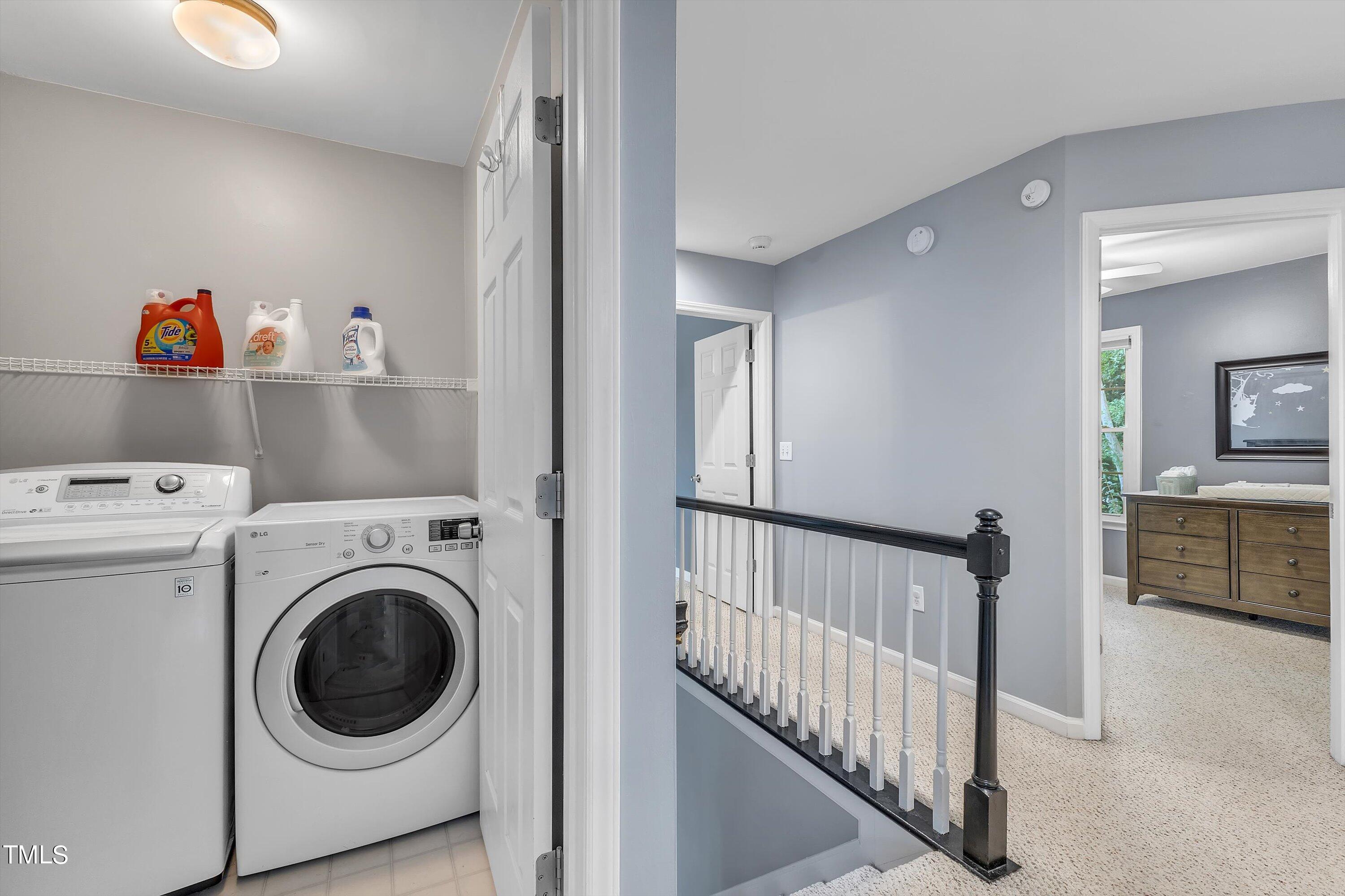 2424 Havershire Drive Raleigh, NC 27613 - Photo 47 of 52 a view of a hallway with washer and dryer