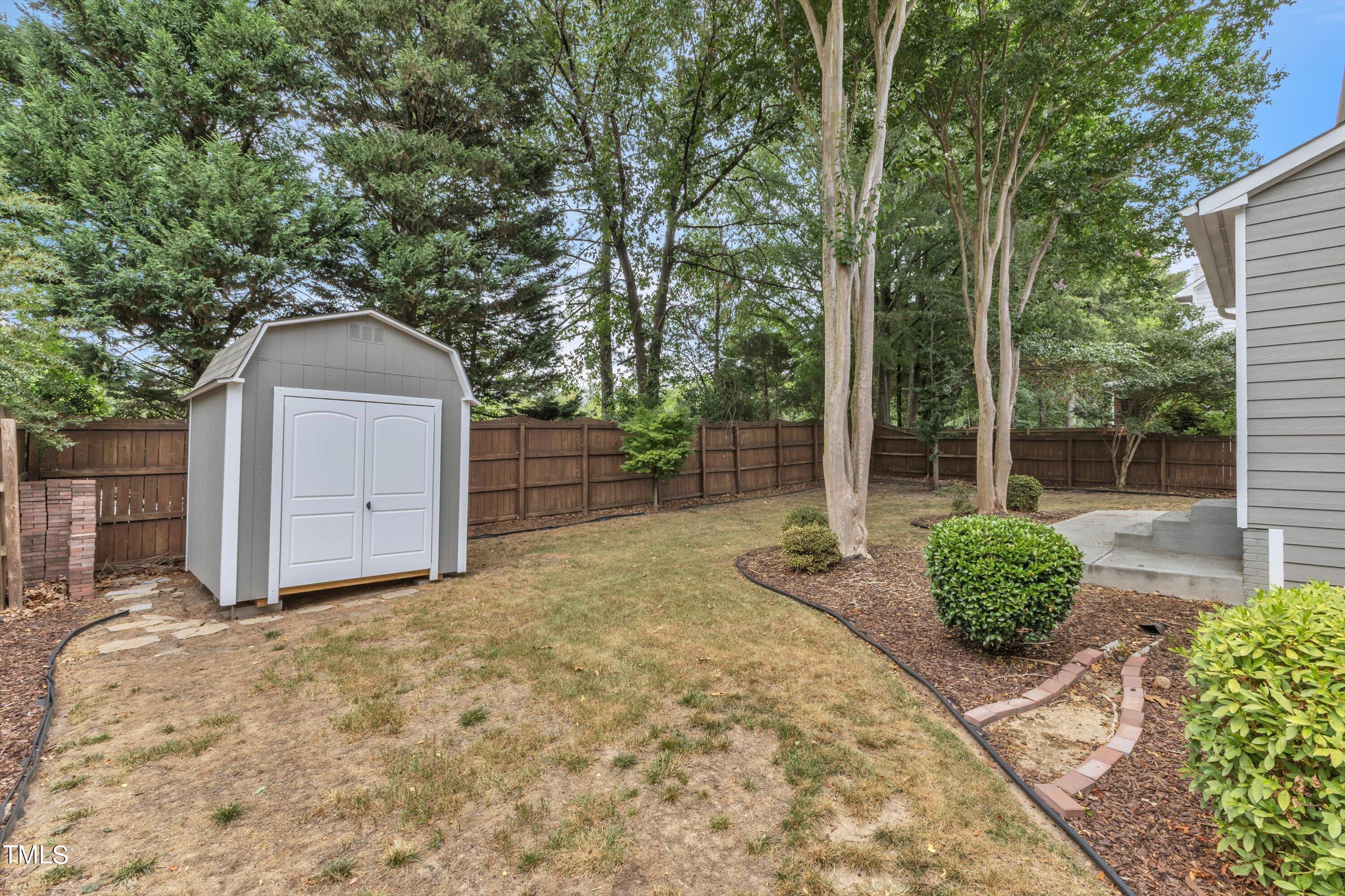 2424 Havershire Drive Raleigh, NC 27613 - Photo 51 of 52 a house view with a garden space