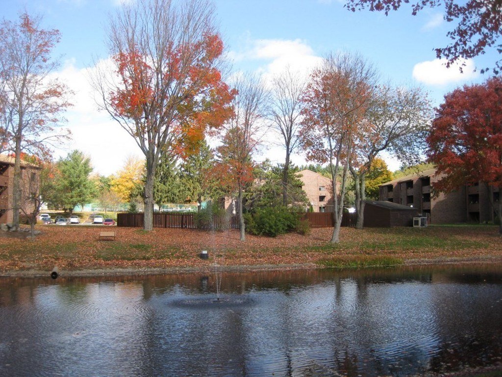 9 Davis Road, Unit B11 Acton, MA 01720 - Photo 1 of 2 a view of a lake with houses