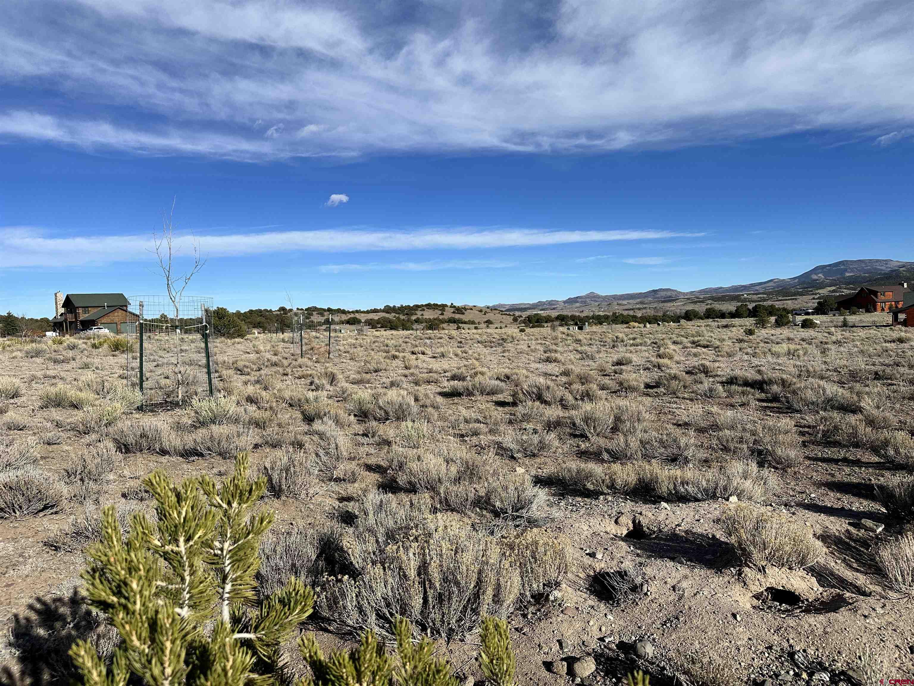 396 Frontier Way South Fork, CO 81154 - Photo 23 of 27 a view of a beach with a building in the background
