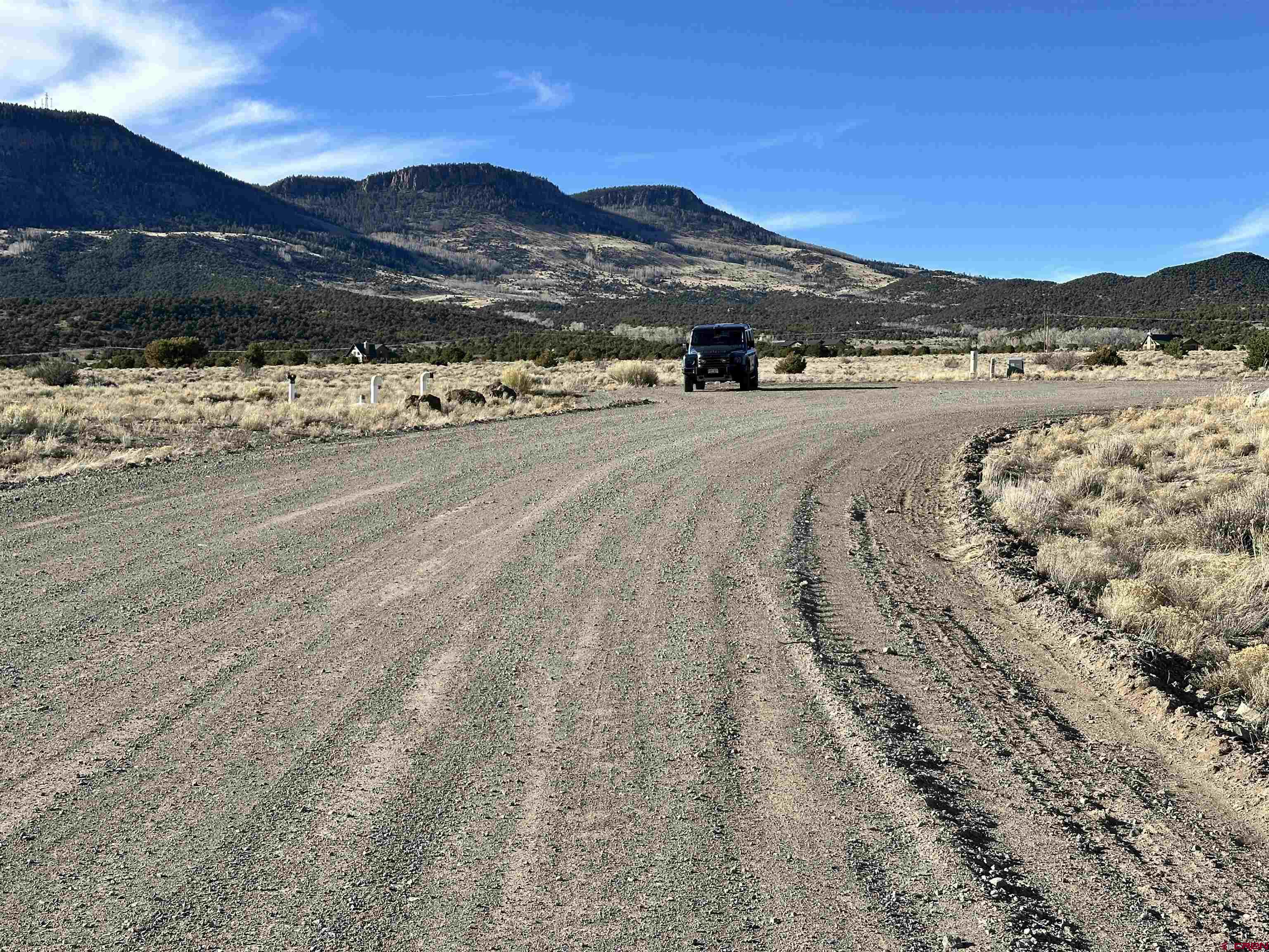 396 Frontier Way South Fork, CO 81154 - Photo 5 of 27 a view of a road with mountains in the background