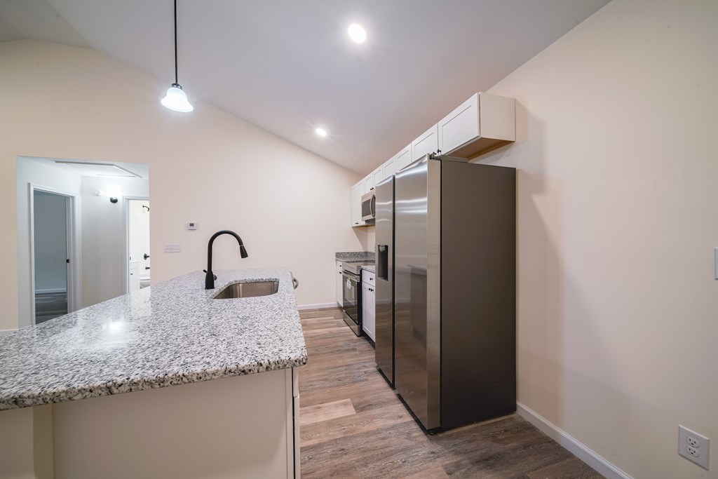1050 Mt Airy Road Waverly Hall, GA 31831 - Photo 11 of 31 a kitchen with kitchen island a counter top space and a sink