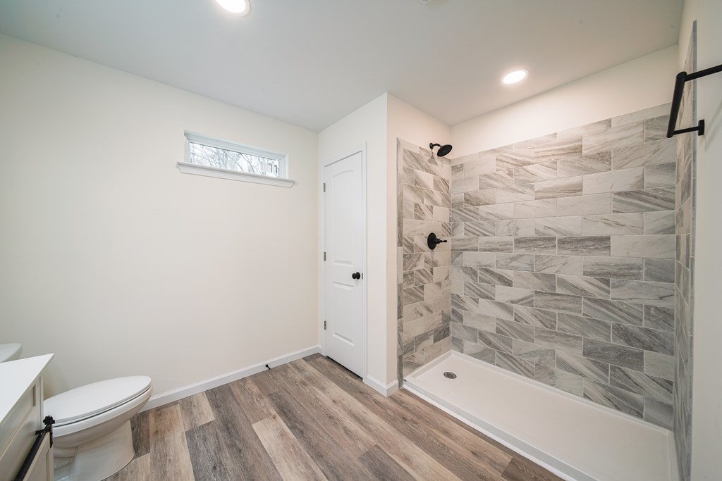 1050 Mt Airy Road Waverly Hall, GA 31831 - Photo 18 of 31 a bathroom with a shower a toilet and a shower